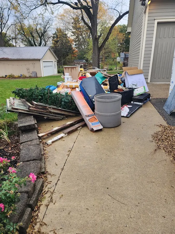 Dumpster being loaded with debris for Roofing Dumpster Rental in Wickliffe